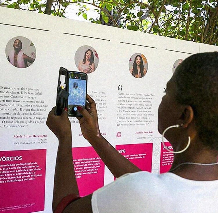 woman taking picture of the board